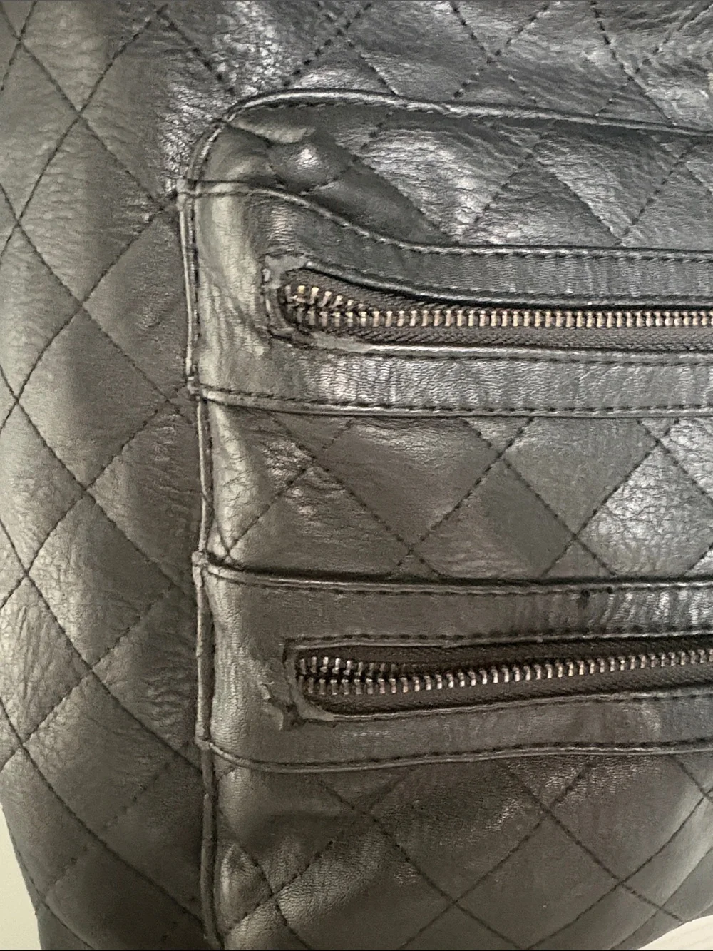 The Honest Company Diamond Quilted Black Faux Leather Backpack